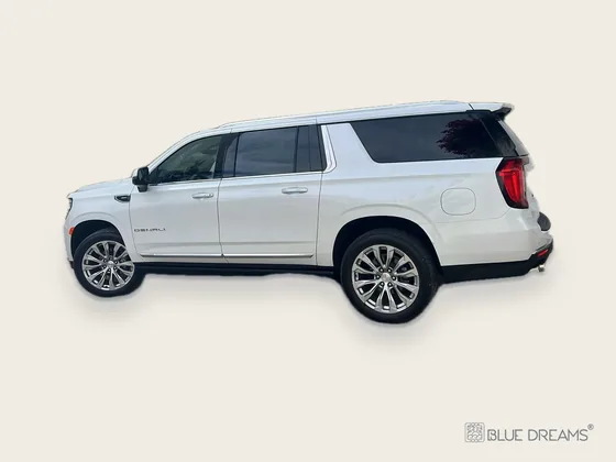 White GMC Yukon Denali from Blue Dreams for a private transfer from Cancun Airport to Bacalar