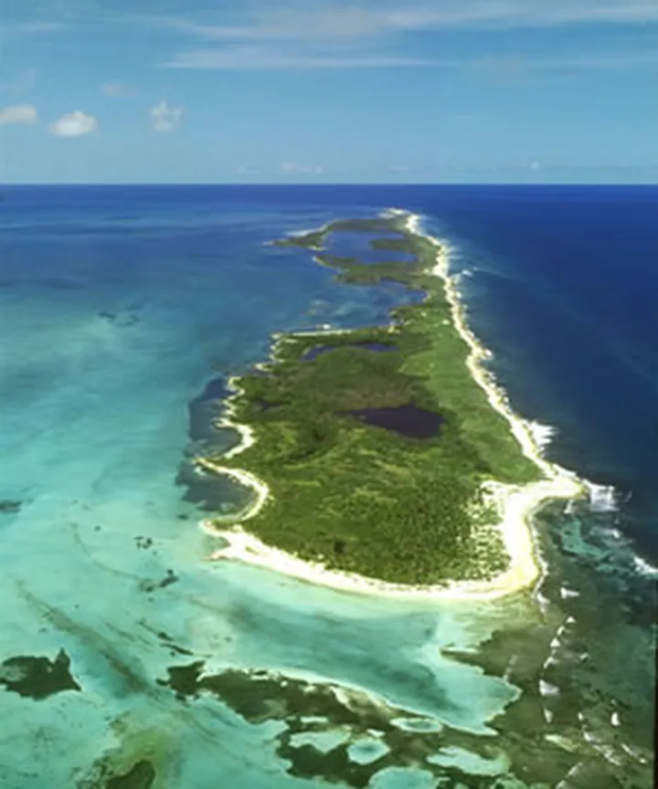 Aerial view of an island in the turquoise Caribbean Sea near Cancún