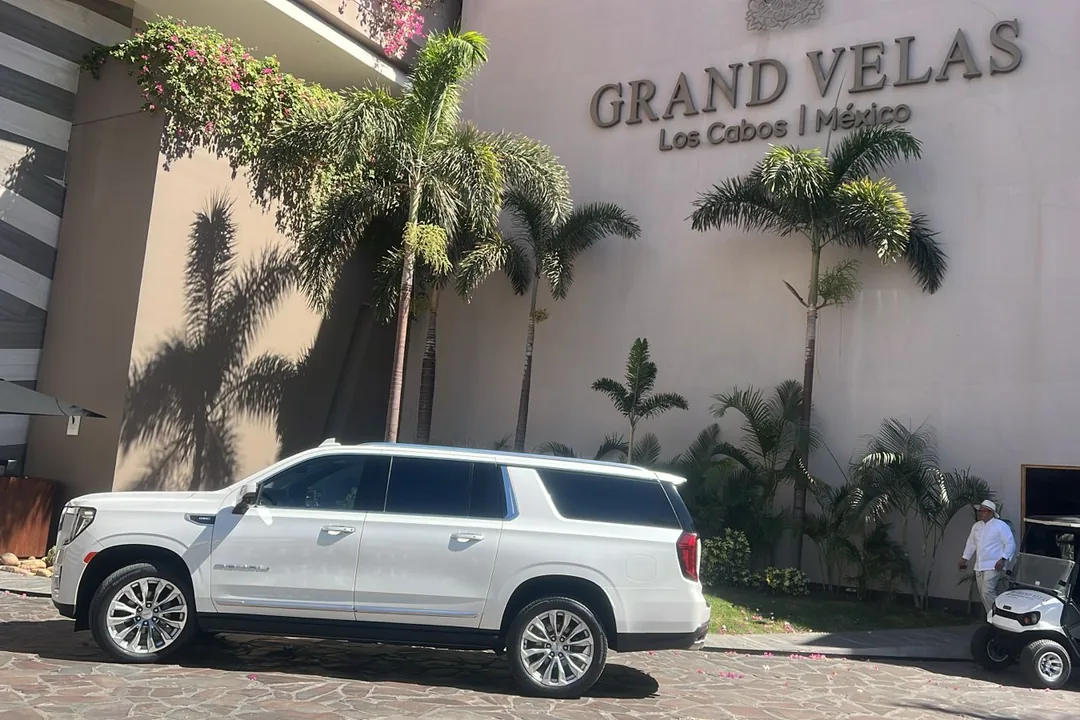 Blue Dreams white GMC Yukon Denali at the entrance of Grand Velas Los Cabos